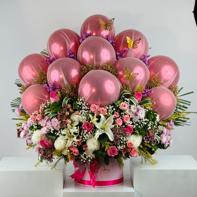 Bouquet of pink balloons and flowers on a white background