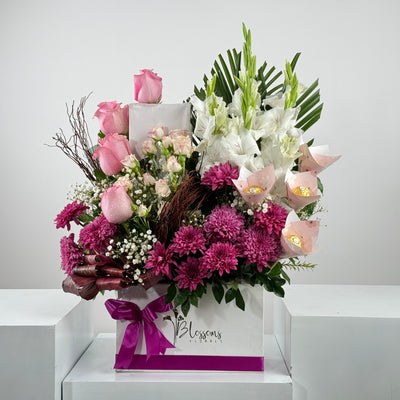 Bouquet of flowers with a 'Blossoms' label on a white background